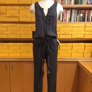 NWT free people jumpsuit. Size XS. In storm grey.